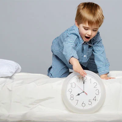 Child winding back clock